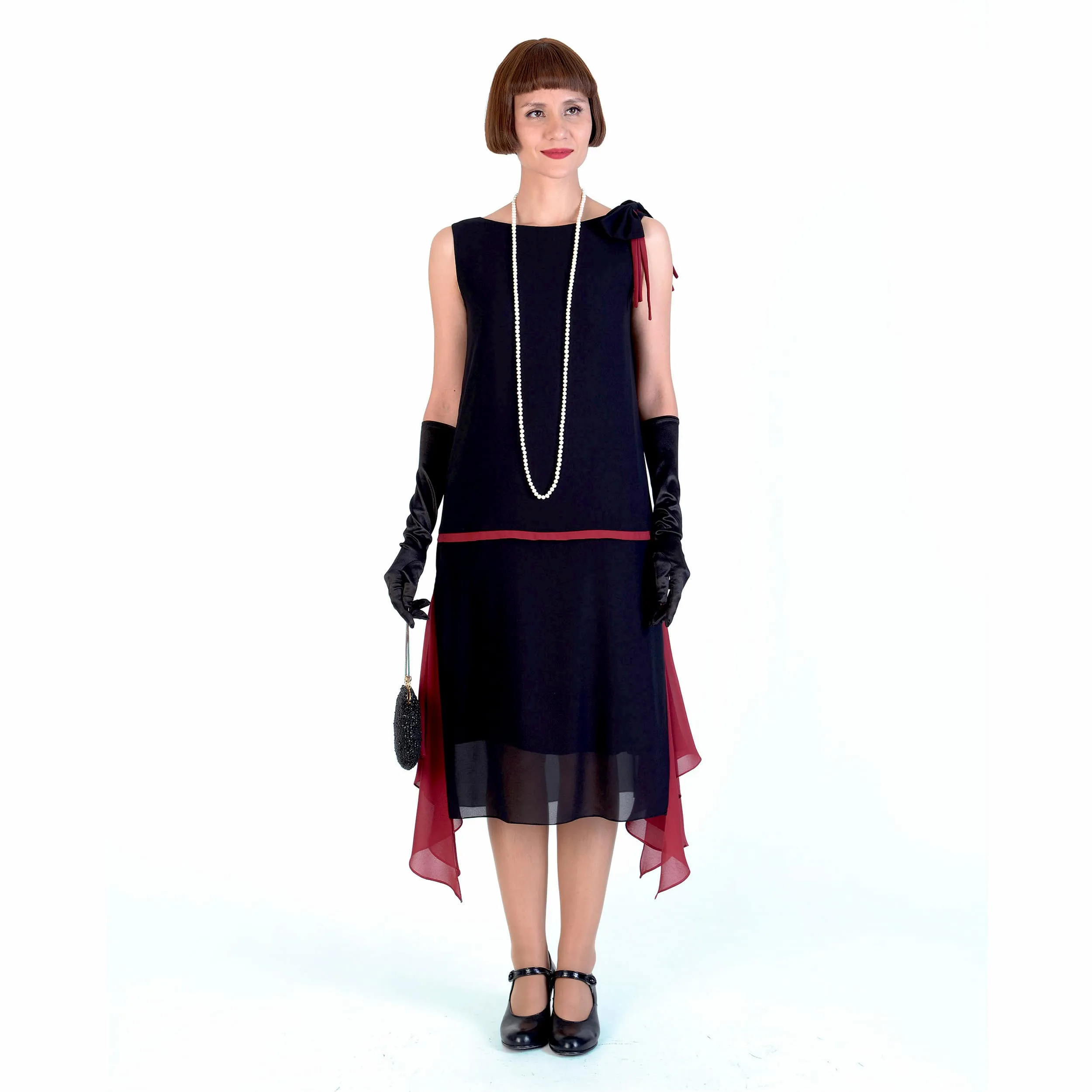 1920s black party dress with red details and shoulder bow