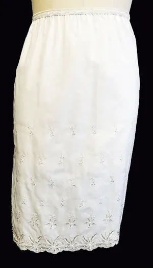 FANCY VINTAGE MOVIE STAR GLISTENING SILVERY WHITE EMBROIDERED EYELET HALF SLIP  - MADE IN THE U.A.